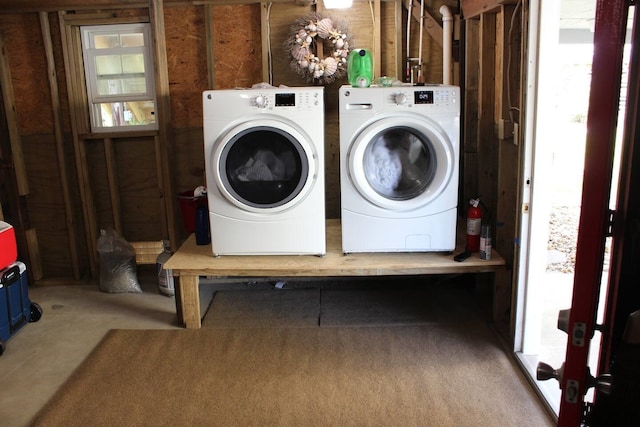 washroom featuring laundry area and washer and dryer