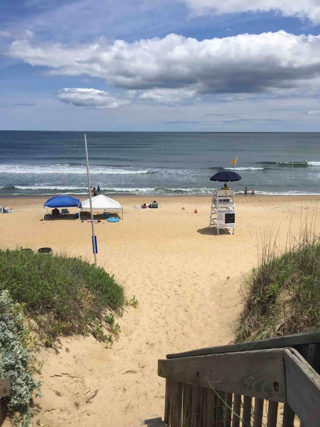 property view of water featuring a beach view