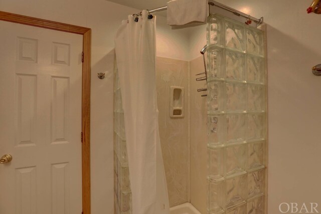 bathroom with a shower with curtain