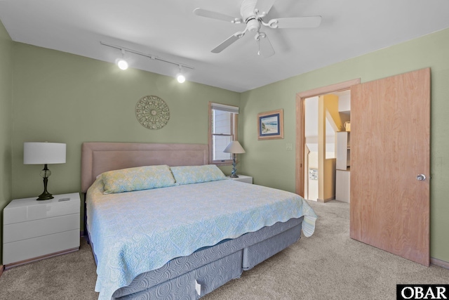 bedroom featuring carpet flooring, ceiling fan, and track lighting