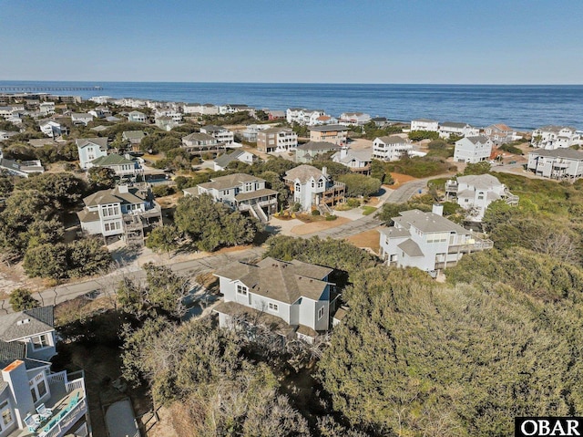 drone / aerial view featuring a water view and a residential view