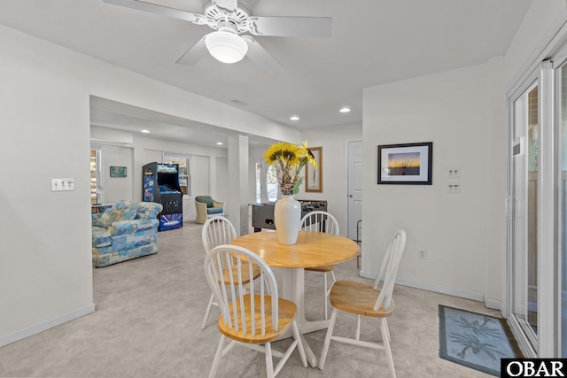 dining area with recessed lighting, light colored carpet, ceiling fan, and baseboards