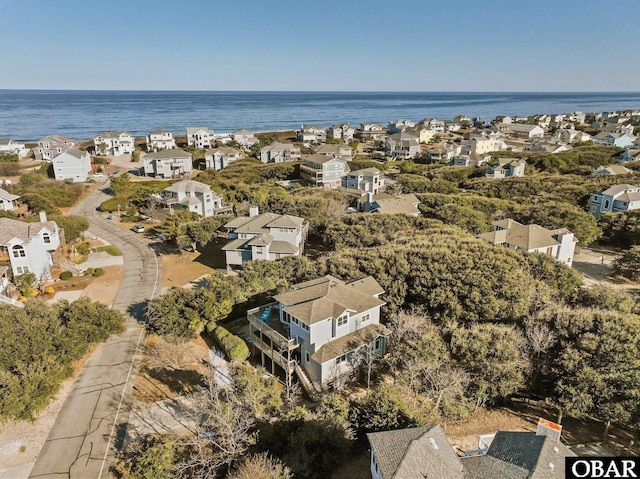 drone / aerial view featuring a residential view and a water view