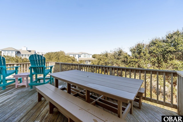 wooden terrace with outdoor dining area