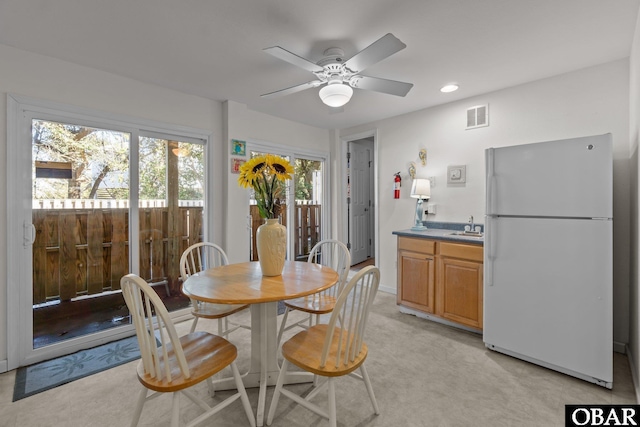 dining room featuring visible vents, a ceiling fan, and recessed lighting