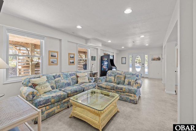 living room with baseboards and recessed lighting