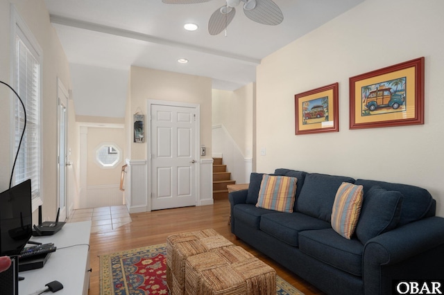 living room with stairs, a ceiling fan, wood finished floors, and recessed lighting