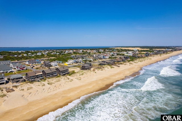 aerial view with a view of the beach and a water view