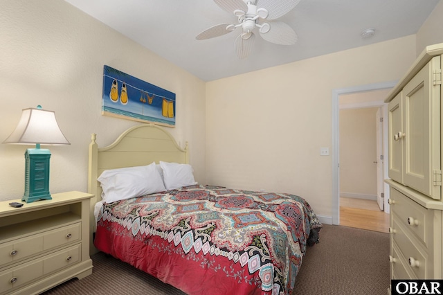 bedroom featuring baseboards, carpet floors, and ceiling fan
