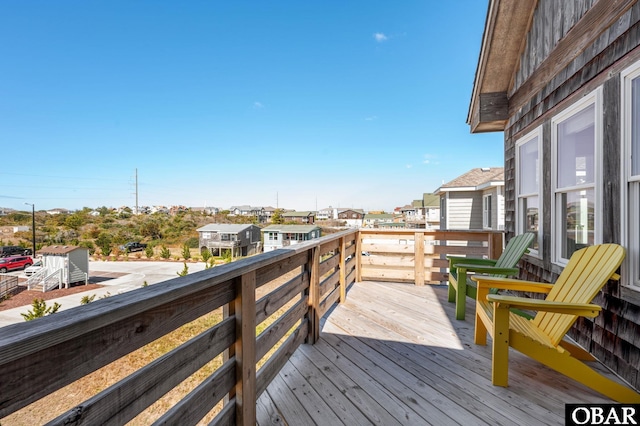 wooden deck with a residential view