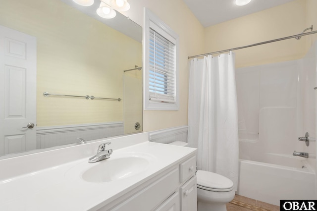 full bath featuring shower / tub combo, toilet, and vanity