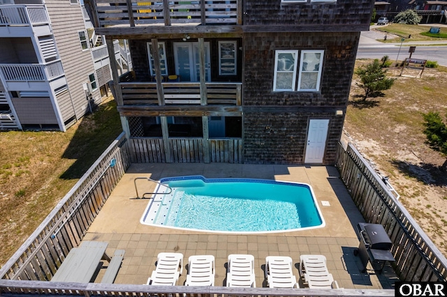 view of pool featuring a patio area and a fenced in pool