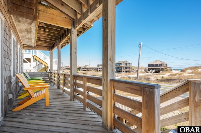 wooden deck featuring stairs