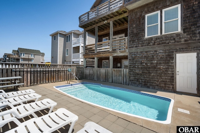 view of pool featuring fence, a fenced in pool, and a patio