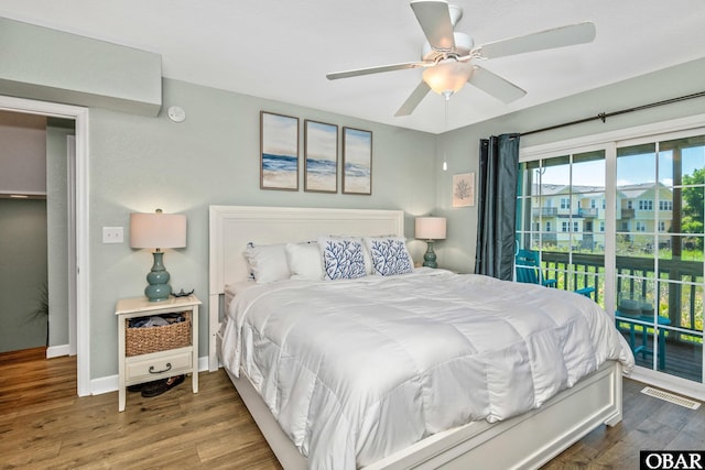 100 Amherst Dr Unit 3, Kill Devil Hills, NC 27948 - bedroom featuring access to exterior, wood finished floors, baseboards, and a ceiling fan