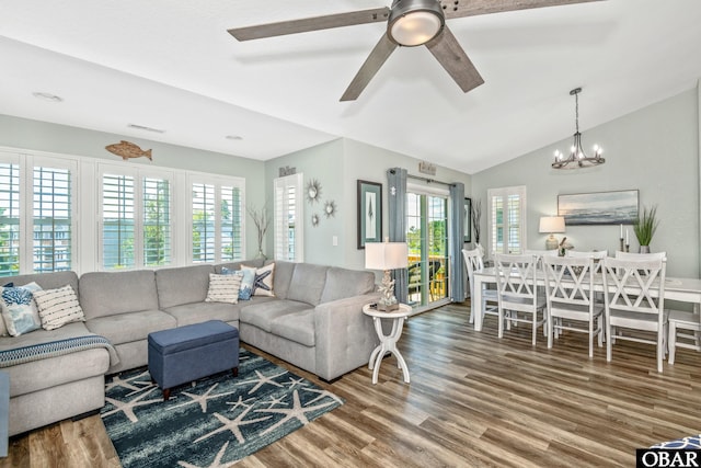 100 Amherst Dr Unit 3, Kill Devil Hills, NC 27948 - living area featuring wood finished floors, lofted ceiling, a chandelier, and a ceiling fan