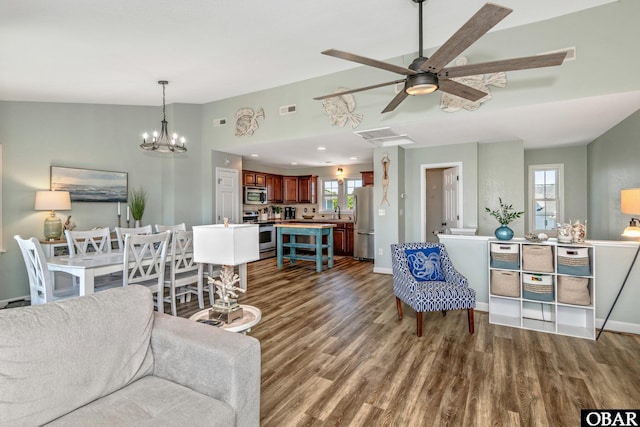 100 Amherst Dr Unit 3, Kill Devil Hills, NC 27948 - living area with wood finished floors, a ceiling fan, a chandelier, vaulted ceiling, and baseboards