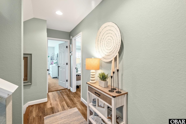100 Amherst Dr Unit 3, Kill Devil Hills, NC 27948 - corridor with wood finished floors, baseboards, recessed lighting, and washer / dryer