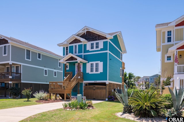 100 Amherst Dr Unit 3, Kill Devil Hills, NC 27948 - coastal home featuring stairway, a front yard, and driveway
