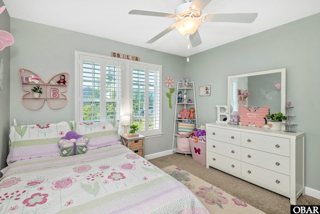 100 Amherst Dr Unit 3, Kill Devil Hills, NC 27948 - bedroom with baseboards, light carpet, and a ceiling fan