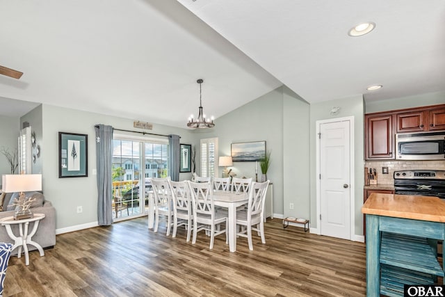 100 Amherst Dr Unit 3, Kill Devil Hills, NC 27948 - dining room featuring baseboards, wood finished floors, a chandelier, vaulted ceiling, and recessed lighting