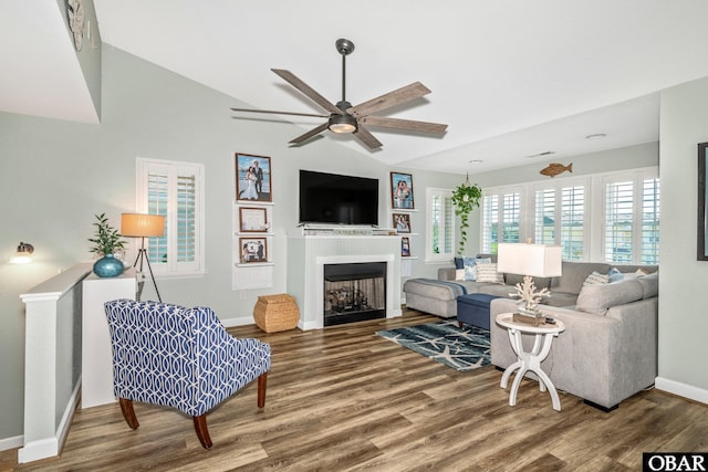 100 Amherst Dr Unit 3, Kill Devil Hills, NC 27948 - living area featuring vaulted ceiling, wood finished floors, baseboards, ceiling fan, and a fireplace