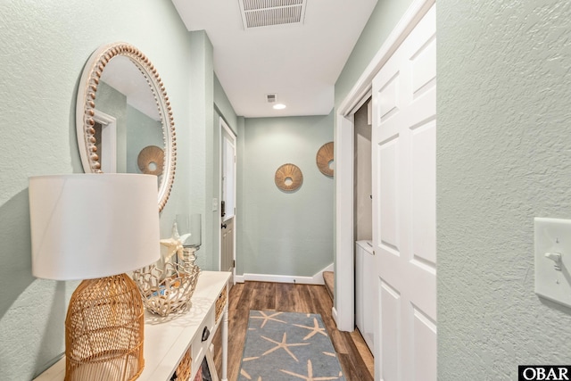 100 Amherst Dr Unit 3, Kill Devil Hills, NC 27948 - corridor with dark wood-type flooring, a textured wall, and baseboards