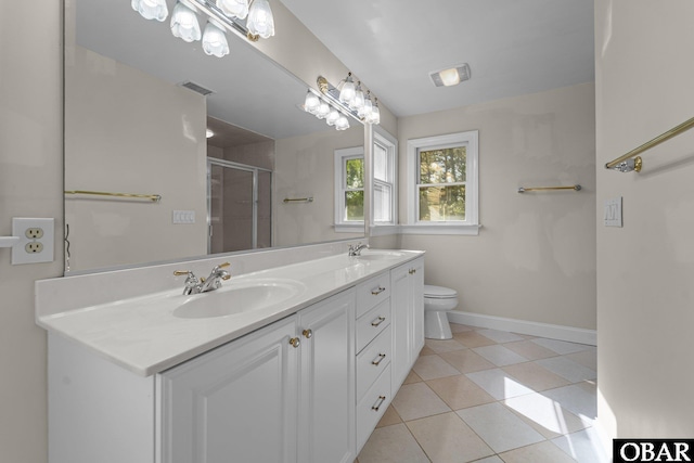 604 W First St Lot 321, Kill Devil Hills, NC 27948 - bathroom featuring double vanity, a stall shower, baseboards, tile patterned flooring, and toilet
