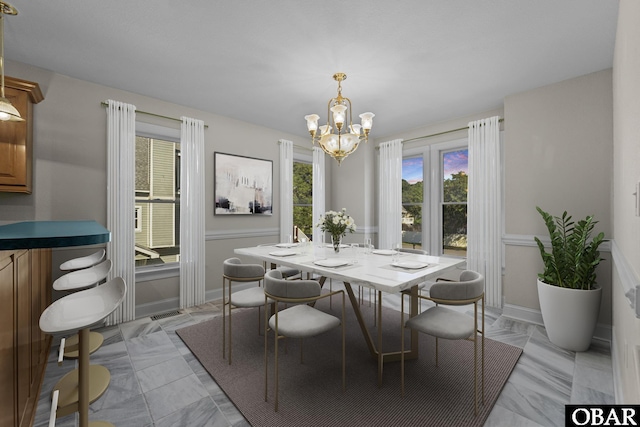 604 W First St Lot 321, Kill Devil Hills, NC 27948 - dining space with a chandelier and baseboards
