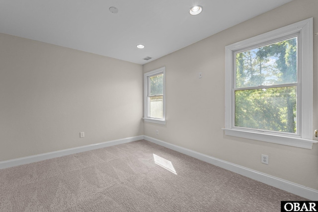 604 W First St Lot 321, Kill Devil Hills, NC 27948 - carpeted empty room featuring healthy amount of natural light, baseboards, and recessed lighting