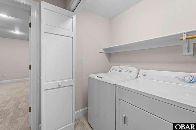 604 W First St Lot 321, Kill Devil Hills, NC 27948 - laundry area with baseboards, washing machine and clothes dryer, and light carpet