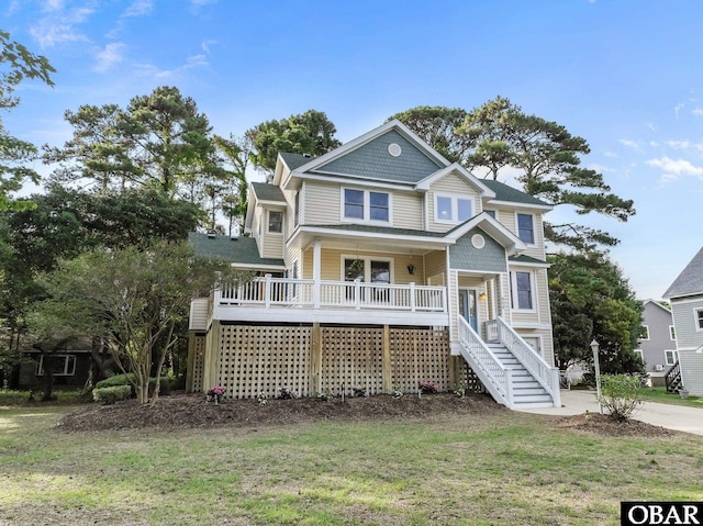 604 W First St Lot 321, Kill Devil Hills, NC 27948 - view of front of property with stairway, a porch, and a front lawn