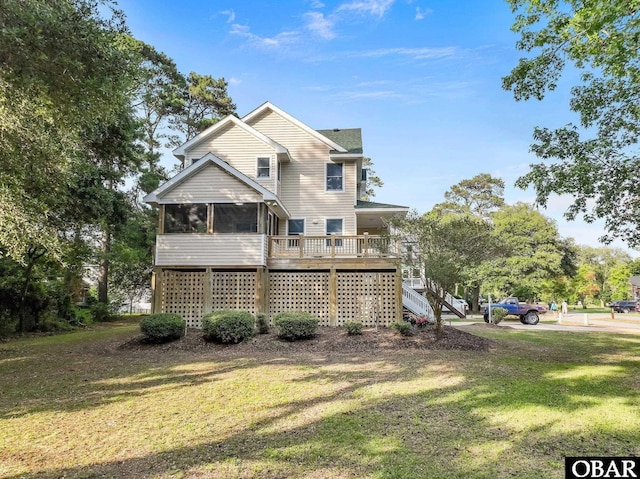 604 W First St Lot 321, Kill Devil Hills, NC 27948 - rear view of property with stairway, a sunroom, and a yard
