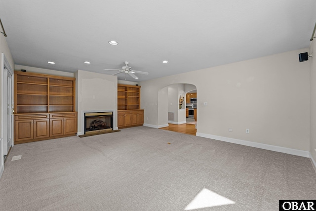 604 W First St Lot 321, Kill Devil Hills, NC 27948 - unfurnished living room featuring a ceiling fan, light carpet, arched walkways, recessed lighting, and baseboards