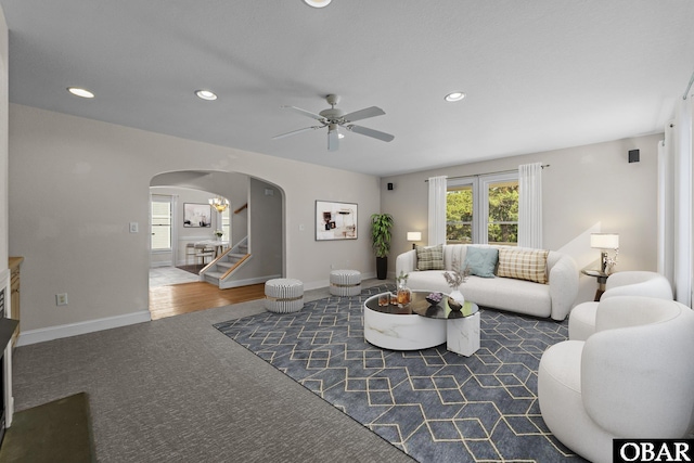 604 W First St Lot 321, Kill Devil Hills, NC 27948 - living room featuring arched walkways, a ceiling fan, recessed lighting, stairs, and carpet flooring