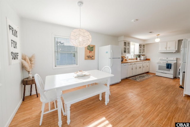 24217 N Holiday Blvd Lot 79, Rodanthe, NC 27968 - dining space featuring light wood-style flooring and baseboards