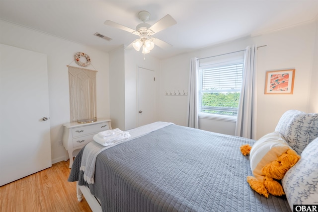 24217 N Holiday Blvd Lot 79, Rodanthe, NC 27968 - bedroom with light wood finished floors and a ceiling fan