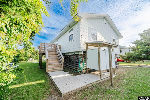 24217 N Holiday Blvd Lot 79, Rodanthe, NC 27968 - rear view of house with a deck, stairs, and a yard
