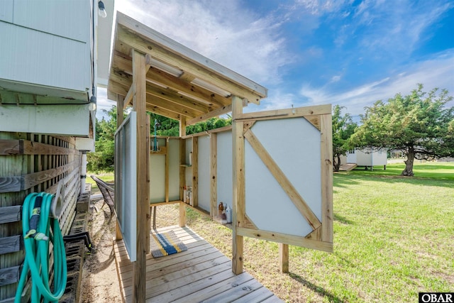 24217 N Holiday Blvd Lot 79, Rodanthe, NC 27968 - wooden deck featuring a lawn