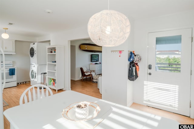 24217 N Holiday Blvd Lot 79, Rodanthe, NC 27968 - dining space featuring estacked washer and dryer and light wood-type flooring