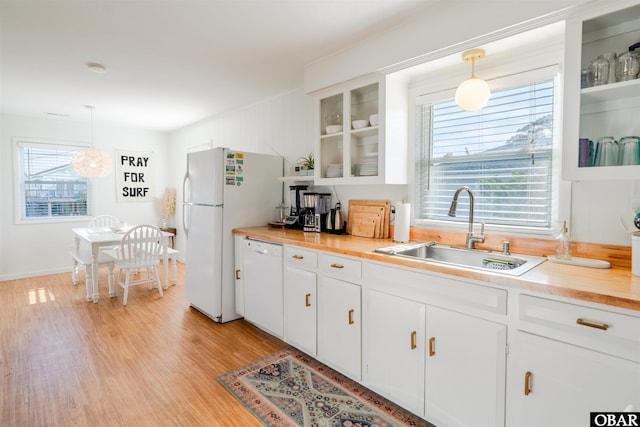 24217 N Holiday Blvd Lot 79, Rodanthe, NC 27968 - kitchen featuring white appliances, light wood finished floors, glass insert cabinets, and white cabinetry