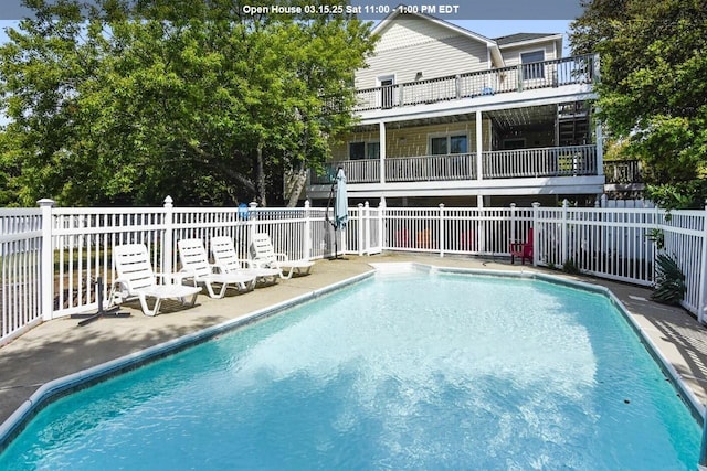 view of swimming pool with fence and a fenced in pool