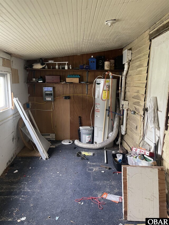 506 Poplar Branch Rd, Poplar Branch, NC 27965 - garage featuring electric water heater and wood walls