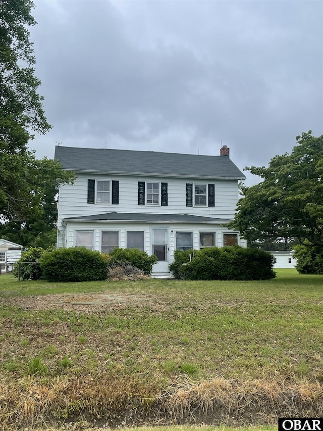 506 Poplar Branch Rd, Poplar Branch, NC 27965 - view of front of property with a chimney and a front lawn