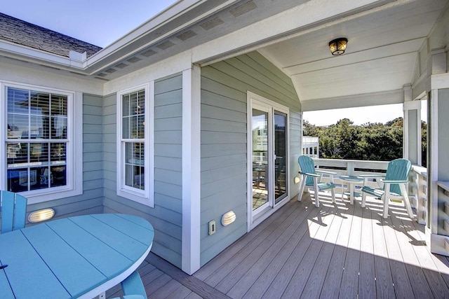 wooden deck featuring outdoor dining space