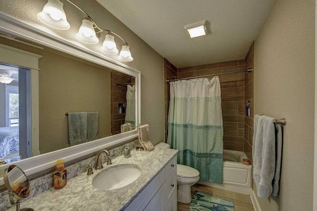 full bath with toilet, a textured ceiling, shower / bath combo, and vanity