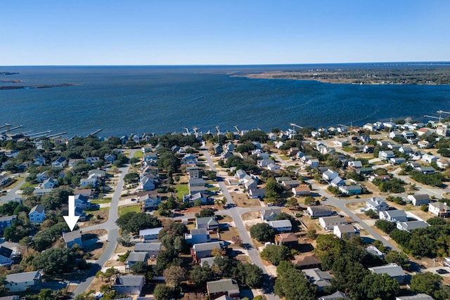 birds eye view of property featuring a water view and a residential view