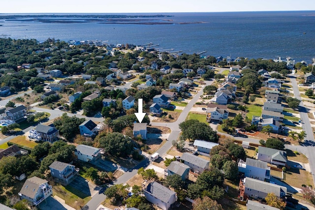 birds eye view of property featuring a water view and a residential view