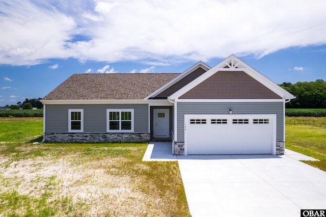 104 Yadkin Dr Lot # 77, South Mills, NC 27973 - craftsman-style home featuring an attached garage, a front lawn, stone siding, and concrete driveway