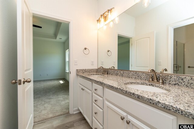104 Yadkin Dr Lot # 77, South Mills, NC 27973 - bathroom featuring double vanity and wood finished floors